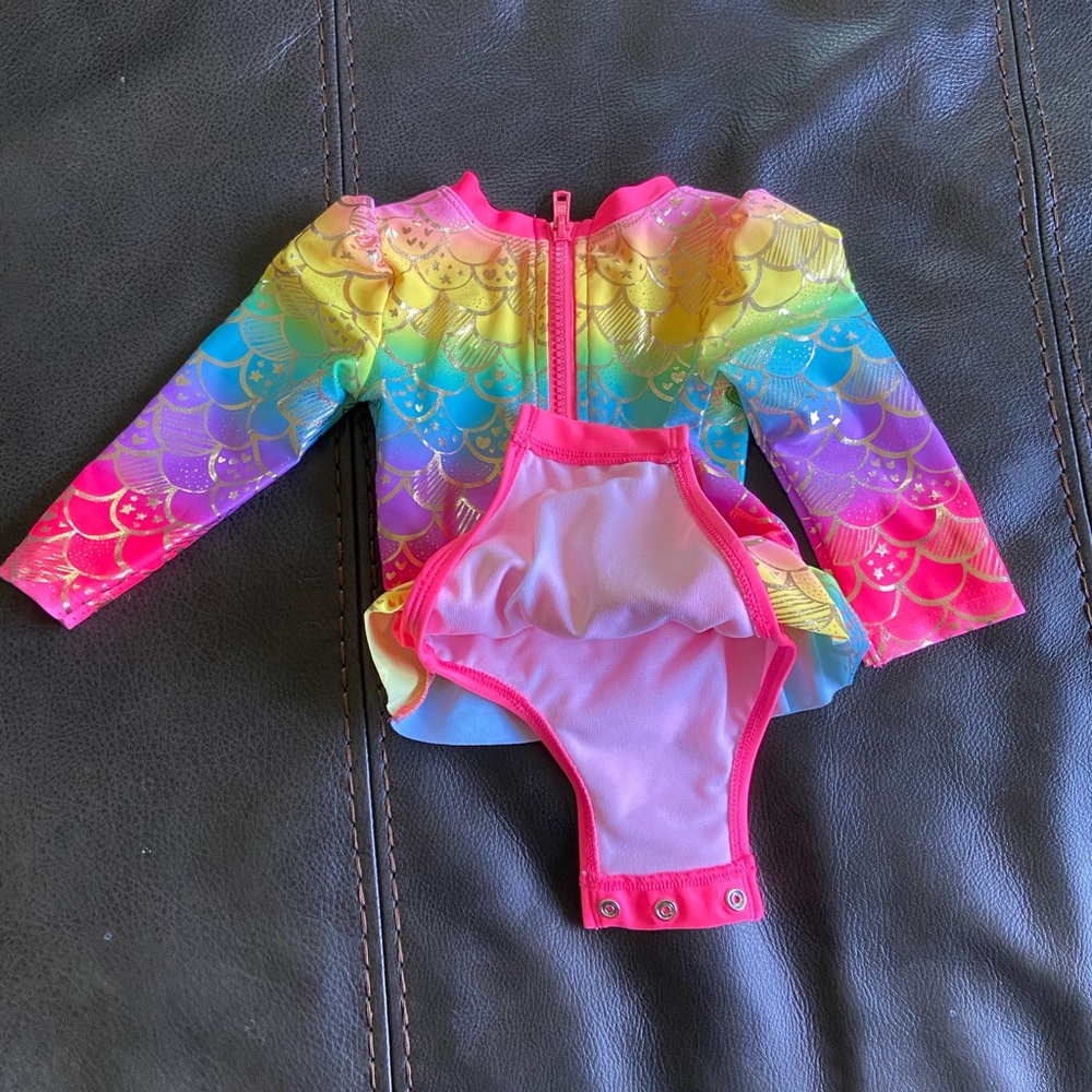 Long sleeve swim suit. New without tags